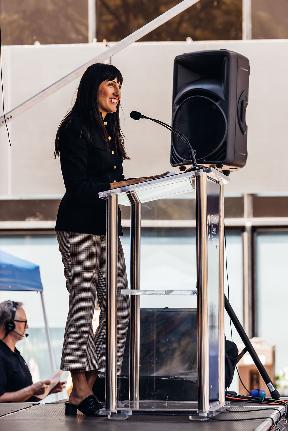 Woman giving speech at podium