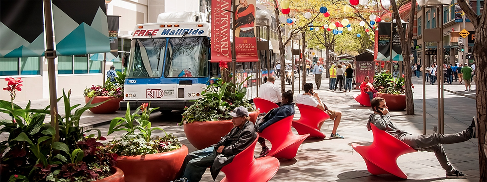People relaxing on red modern chairs, Free MallRide bus nearby