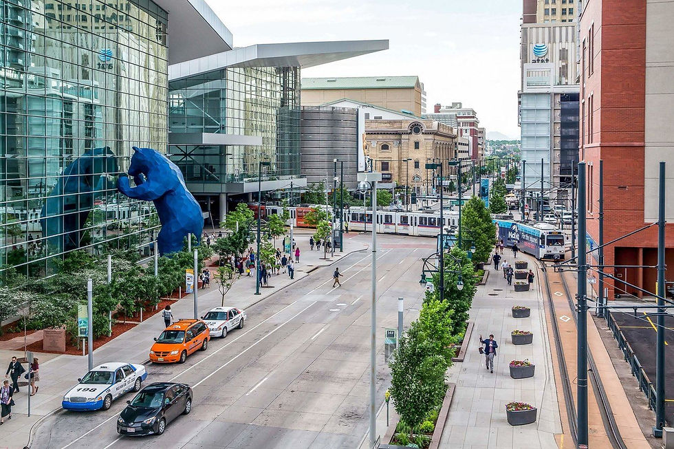 Denver Convention Center with light rail and blue bear sculpture